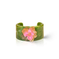 Marble-effect cuff bracelet with pink floral charm and gold-tone details