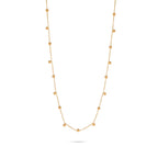Slim gold-tone necklace with evenly spaced small bead-drop details