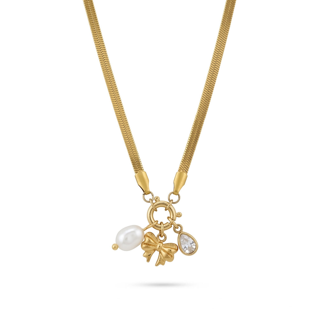 Gold-tone necklace with bow, pearl drop and clear stone charms