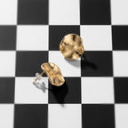 Gold-tone molten pebble stud earrings for women with an irregular sculpted surface